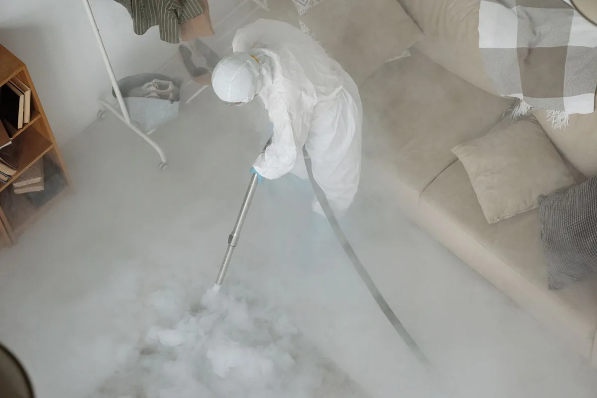 Biohazard cleanup technician in protective equipment, Oostburg, WI